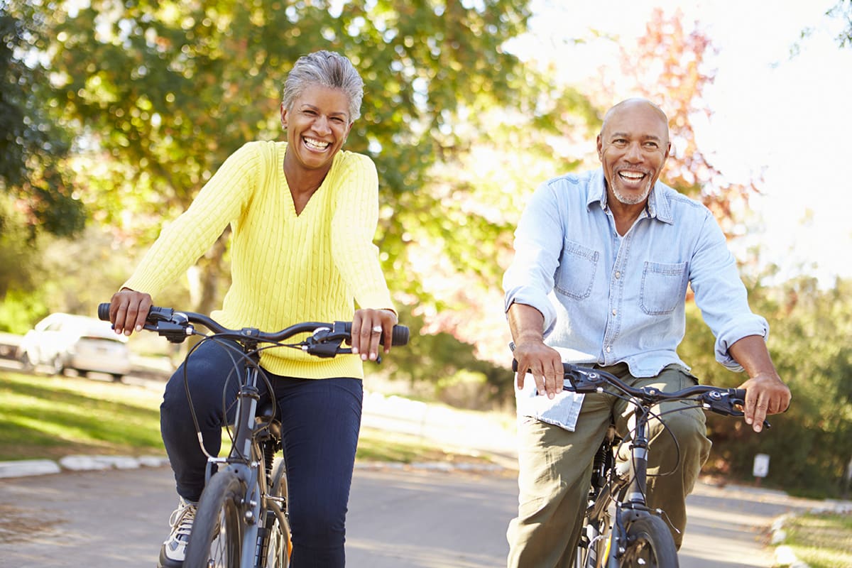 Senior,Couple,On,Cycle,Ride,In,Countryside healthy couple riding their bikes