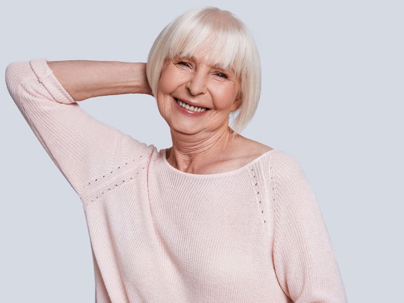 LM-inflammation-and-aging-main-image A happy older woman smiling to illustrate how to overcome the risks of inflammation and aging