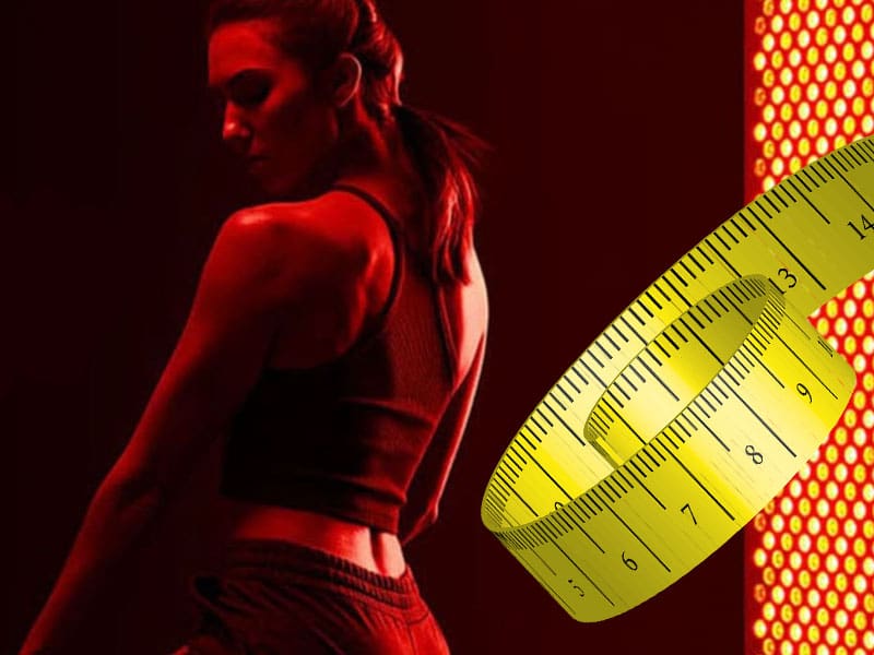LM-red-light-therapy-help-weight-loss back view of woman having red light therapy help with weight loss and a superimposed tape measure